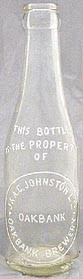 J. AND A. G. JOHNSTON LIMITED OAKBANK BREWERY EMBOSSED BEER BOTTLE