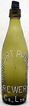 NEWPORT PAGNELL BREWERY COMPANY LIMITED EMBOSSED BEER BOTTLE