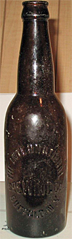 THE INTERNATIONAL BREWING COMPANY EMBOSSED BEER BOTTLE
