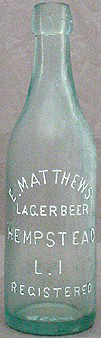 E. MATTHEWS LAGER BEER EMBOSSED BEER BOTTLE