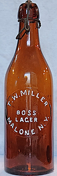 T. W. MILLER BOSS LAGER EMBOSSED BEER BOTTLE