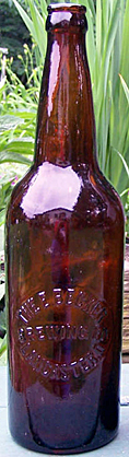 THE E. BECKER BREWING COMPANY EMBOSSED BEER BOTTLE