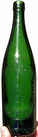 THE FOSTER BREWING COMPANY EMBOSSED BEER BOTTLE