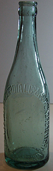 M. V. COMPANY AND HORONDA BREWERY EMBOSSED BEER BOTTLE