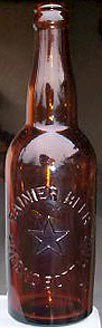 RAINIER BEER EMBOSSED BEER BOTTLE