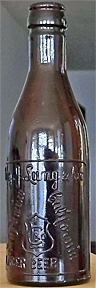 AUGUST J. LANG & COMPANY LAGER BEER EMBOSSED BEER BOTTLE