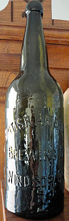 BRITISH AMERICAN BREWING COMPANY EMBOSSED BEER BOTTLE