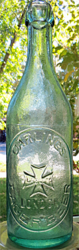 CARLINGS LAGER BEER EMBOSSED BEER BOTTLE