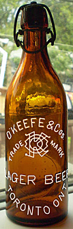 O'KEEFE & COMPANIES LAGER BEER EMBOSSED BEER BOTTLE