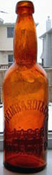 REINHARDT & COMPANY LAGER EMBOSSED BEER BOTTLE