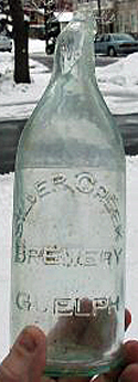 SILVER CREEK BREWERY EMBOSSED BEER BOTTLE