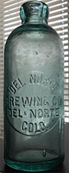 DEL NORTE BREWING COMPANY EMBOSSED BEER BOTTLE