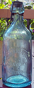 JEAN HORNIG & COMPANY WEISS BEER EMBOSSED BEER BOTTLE