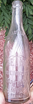 THE AETNA BREWING COMPANY EMBOSSED BEER BOTTLE