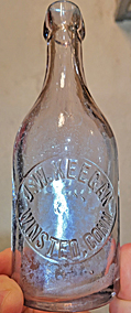 J. W. KEEGAN WEISS BEER EMBOSSED BEER BOTTLE