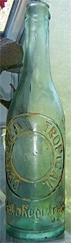 CERVEZA TROPICAL EMBOSSED BEER BOTTLE