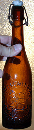 BRAUEREI LOWENBRAU A. G. EMBOSSED BEER BOTTLE