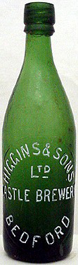 HIGGINS & SONS LIMITED CASTLE BREWERY EMBOSSED BEER BOTTLE