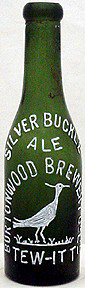 SILVER BUCKLE ALE BURTONWOOD BREWERY COMPANY LIMITED EMBOSSED BEER BOTTLE