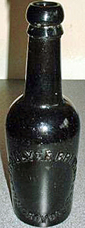 NALDER COLLYER BREWERY COMPANY LIMITED EMBOSSED BEER BOTTLE