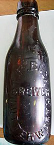 T. P. BUCK BREWER EMBOSSED BEER BOTTLE