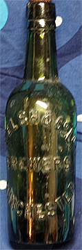 WELSH & COMPANY LIMITED BREWERS EMBOSSED BEER BOTTLE