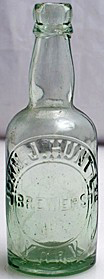 JOHN J. HUNT LIMITED BREWERS EMBOSSED BEER BOTTLE