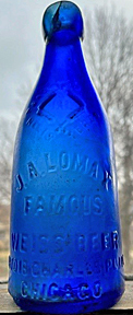 JOHN A. LOMAX FAMOUS WEISS BEER EMBOSSED BEER BOTTLE