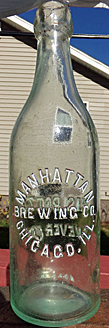 MANHATTAN BREWING COMPANY EMBOSSED BEER BOTTLE