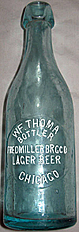 FRED MILLER BREWING COMPANY EMBOSSED BEER BOTTLE