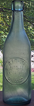 FRED MILLER BREWING COMPANY EMBOSSED BEER BOTTLE