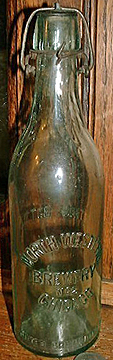 NORTH WESTERN BREWERY EMBOSSED BEER BOTTLE