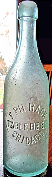 F. PHILLIP RACK TABLE BEER EMBOSSED BEER BOTTLE