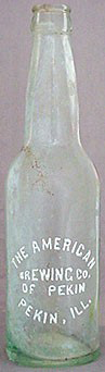 THE AMERICAN BREWING COMPANY OF PEKIN EMBOSSED BEER BOTTLE