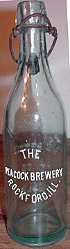 THE PEACOCK BREWERY EMBOSSED BEER BOTTLE