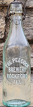 THE PEACOCK BREWERY EMBOSSED BEER BOTTLE