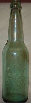 WAUKEGAN BREWING COMPANY EMBOSSED BEER BOTTLE