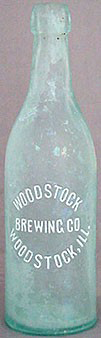 WOODSTOCK BREWING COMPANY EMBOSSED BEER BOTTLE