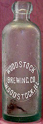 WOODSTOCK BREWING COMPANY EMBOSSED BEER BOTTLE