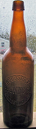 WOODSTOCK BREWING COMPANY EMBOSSED BEER BOTTLE