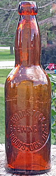 WOODSTOCK BREWING COMPANY EMBOSSED BEER BOTTLE