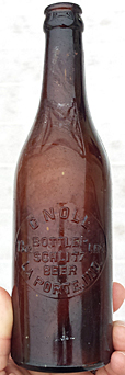 C. NOLL BOTTLER SCHLITZ BEER EMBOSSED BEER BOTTLE