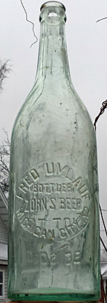 FRED UMLAUF BOTTLER ZORN'S BEER EMBOSSED BEER BOTTLE