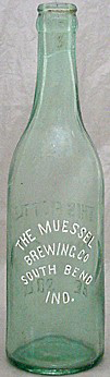 THE MUESSEL BREWING COMPANY EMBOSSED BEER BOTTLE