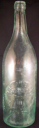 THE MUESSEL BREWING COMPANY EMBOSSED BEER BOTTLE