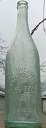 THE MUESSEL BREWING COMPANY EMBOSSED BEER BOTTLE