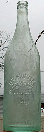 THE MUESSEL BREWING COMPANY EMBOSSED BEER BOTTLE