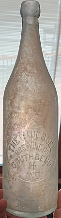 THE MUESSEL BREWING COMPANY EMBOSSED BEER BOTTLE