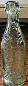 LAGER BEER BOTTLED BY F. GOMILA EMBOSSED BEER BOTTLE