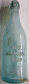 NEW ORLEANS BREWING ASSOCIATION EMBOSSED BEER BOTTLE